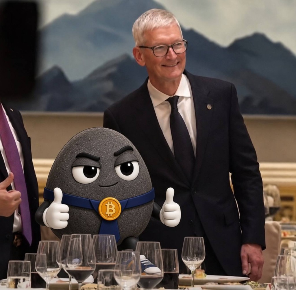 The rock giving a double thumbs up at a formal dinner next to a man in a suit